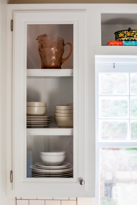 Glass front cabinets. Displaying dishes in open cabinets.